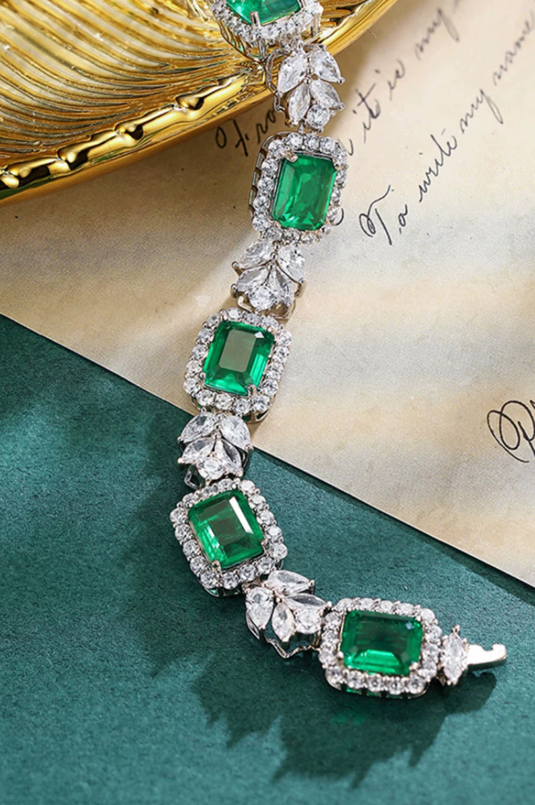 "Luxurious and refined S925 Sterling Silver Bracelet featuring lab-created emerald square-cut stones, exuding elegance and sophistication with a fully adorned design."