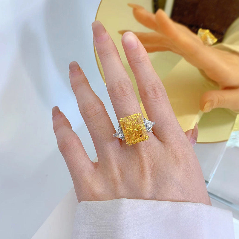 Luxury lavishly adorned 10-carat yellow diamond ring, high-end texture with a dazzling sparkle.