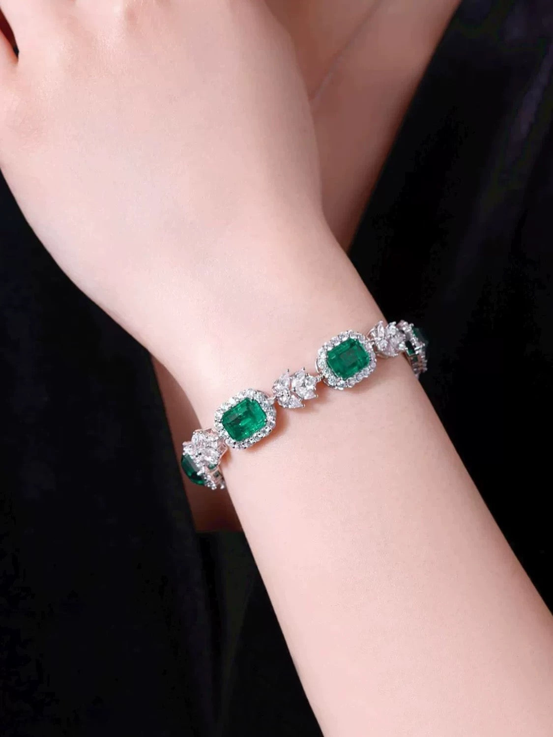 "Luxurious and refined S925 Sterling Silver Bracelet featuring lab-created emerald square-cut stones, exuding elegance and sophistication with a fully adorned design."